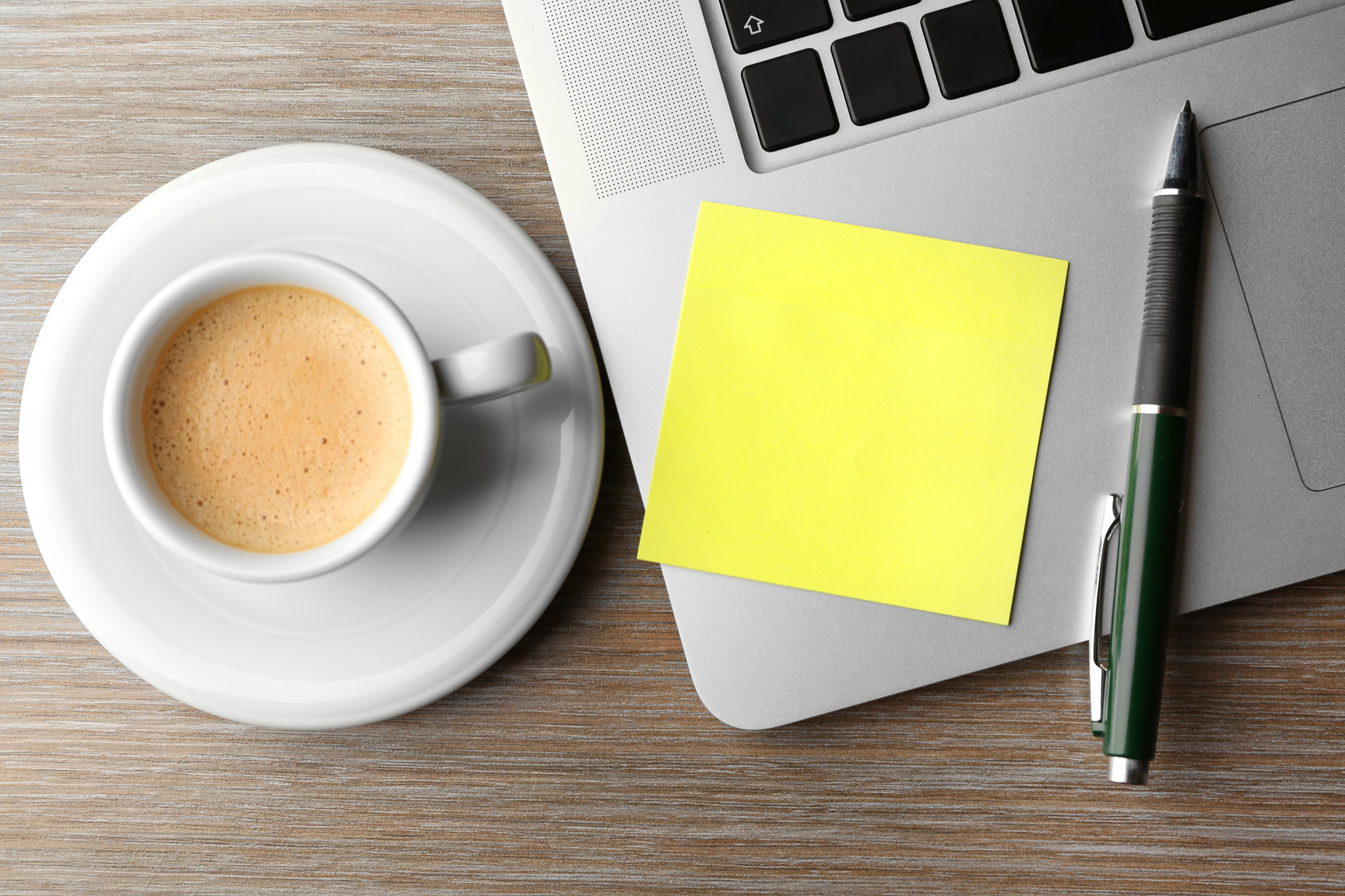 Sticky Paper, Laptop Keyboard, Pen and Coffee Cup on Desk